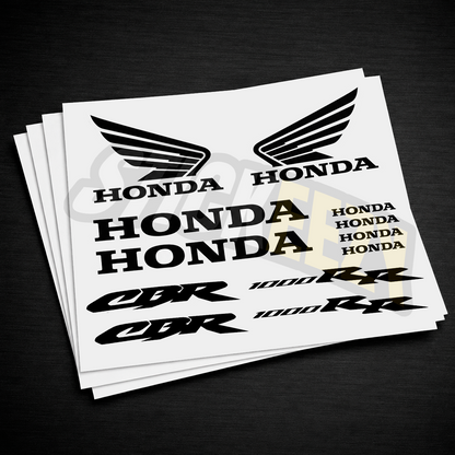 Sheet of Honda decals including logos and model names on a black background