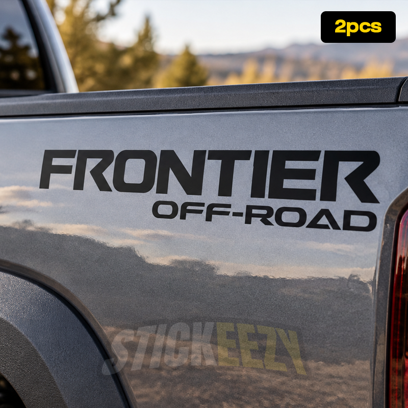 Nissan Frontier vinyl bedside lettering decal positioned on the upper rear corner of the pickup truck bed near the taillight