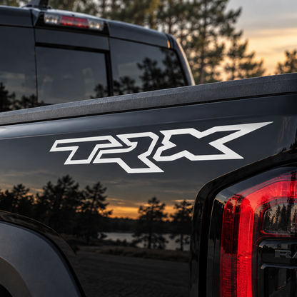 RAM TRX bedside vinyl decal installed on the upper rear section of a pickup truck bed