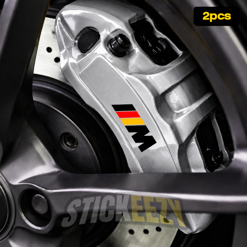 BMW M brake caliper vinyl decal featuring a German flag-inspired black, red, and gold design for custom painted brake calipers